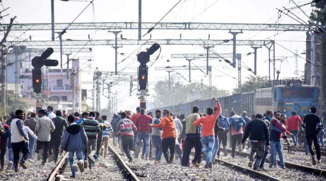 Aspirants block railway tracks during their protest over alleged erroneous results of Railway Recruitment Board's Non-Technical Popular Categories (RRB NTPC) exam 2021, in Prayagraj. (PTI)