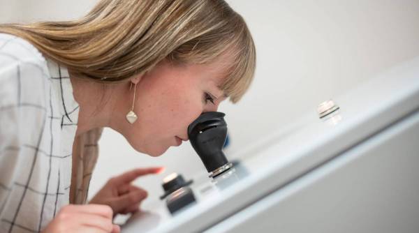 Naomi Liester, who works for St. Croix Sensory as a smell assessor, uses one of the labÕs olfactometers in South St. Paul, Minn., Aug. 2, 2021. (Caroline Yang/The New York Times)