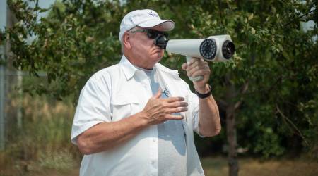 Chuck McGinley with his Nasal Ranger in South St. Paul, Minn., Aug. 3, 2021. (Caroline Yang/The New York Times)