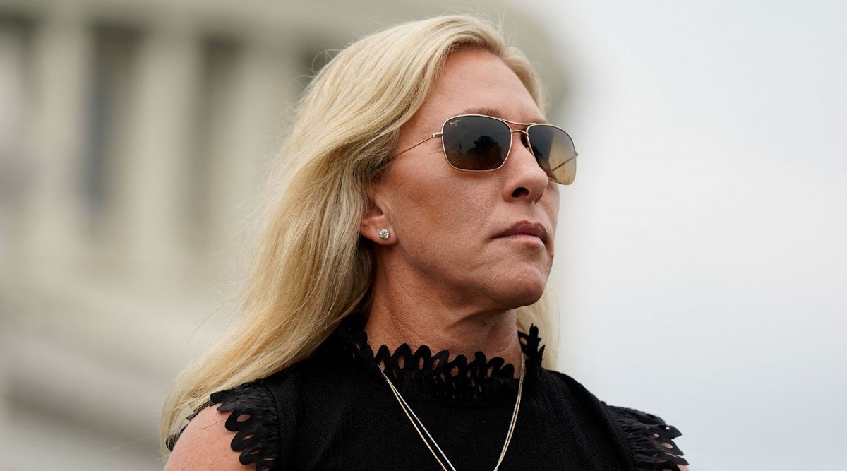 U.S. Rep. Marjorie Taylor Greene (R-GA) listens as Rep. Matt Gaetz (R-FL) speaks during a news conference outside the U.S. Capitol in Washington, U.S., July 29, 2021. (Reuters)