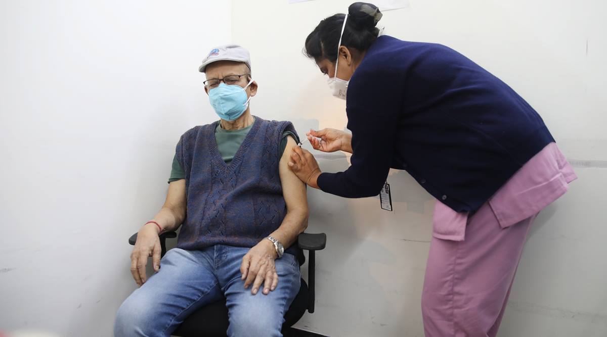 A man receives a Covid-19 booster dose from a healthworker. (Representational Photo: Partha Paul)