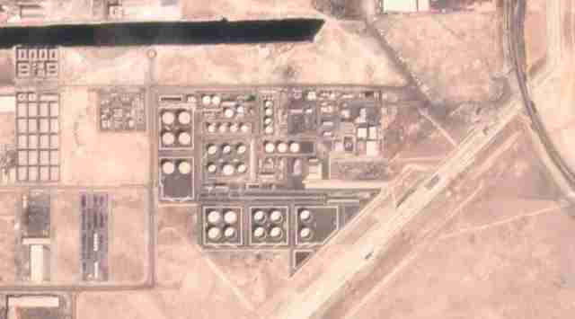 In this satellite image provided by Planet Labs PBC, an Abu Dhabi National Oil Co. fuel depot in the Mussafah neighborhood of Abu Dhabi, United Arab Emirates, is seen Saturday, Jan. 15, 2022, before being targeted in an attack days later.  