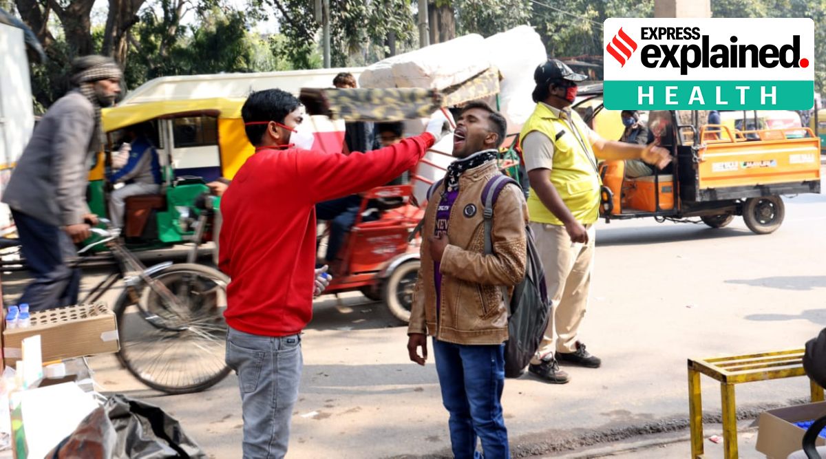 A healthworker collects swab sample for Covid-19 test at Old Delhi Ajmeri Gate  in New Delhi, Thursday.  (Express Photo By Amit Mehra)