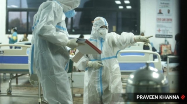 Doctors check Covid-19 patients at CWG Covid Care Centre in New Delhi