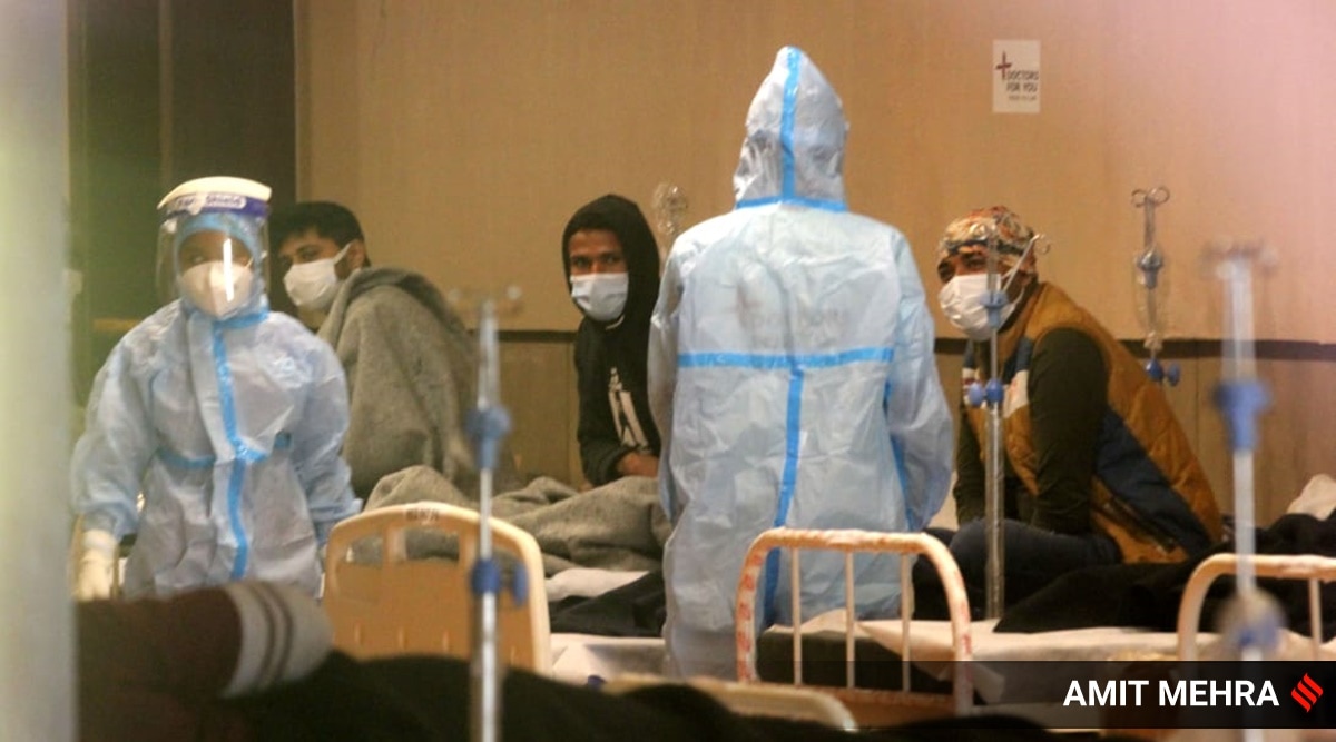 Patients receive treatment inside a shehnai banquet hall, converted into Covid-19 isolation center, in New Delhi, on Wednesday. (Express Photo By Amit Mehra)