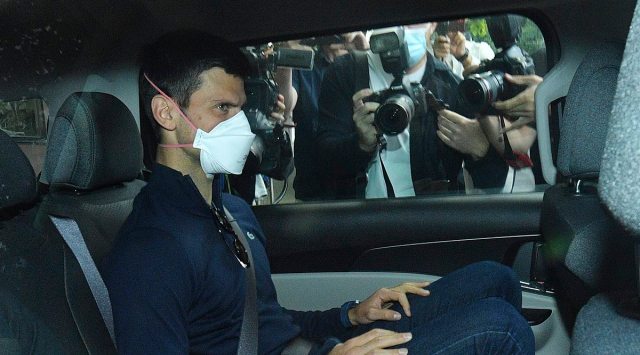 Melbourne : Serbian tennis player Novak Djokovic rides in car as he leaves a government detention facility before attending a court hearing at his lawyers office in Melbourne, Australia, Sunday, Jan. 16, 2022. A federal court hearing has been scheduled for Sunday, a day before the men's No. 1-ranked tennis player and nine-time Australian Open champion was due to begin his title defense at the first Grand Slam tennis tournament of the year. (Source: AP)