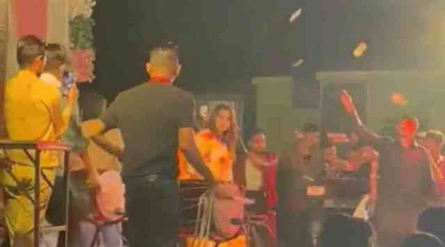 Currency notes being thrown in air as a local singer performs in live orchestra event held to celebrate second birthday of Abby the pet dog in Nikol of Ahmedabad on Friday night. 
