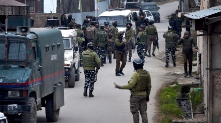 Security personnel during an encounter at Gusoo village on the outskirts of Srinagar, Monday, Jan. 3, 2022. (PTI Photo/S. Irfan)