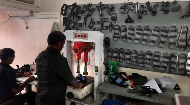 Patients who have recovered from leprosy and their relatives manufacture MCR footwear in a workshop in Mumbai. (Express Photo by Pradip Das)