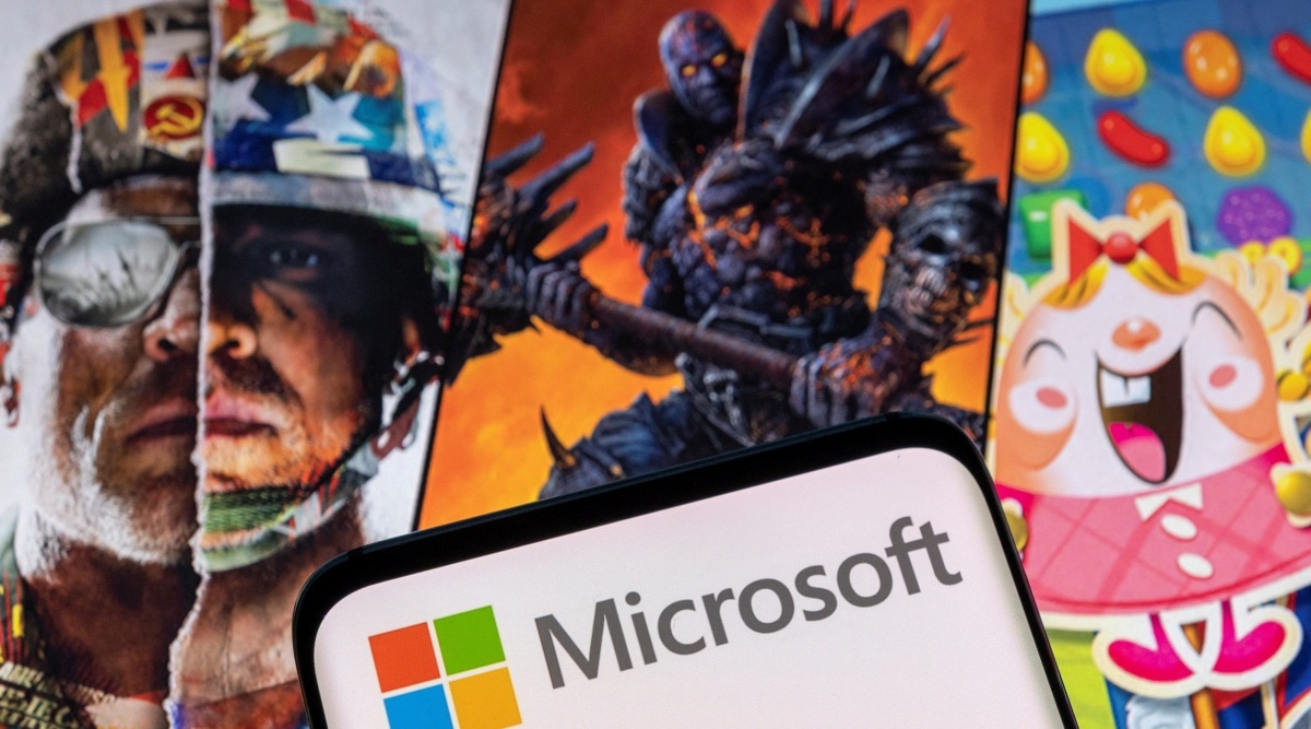 Microsoft logo is seen on a smartphone placed on displayed Activision Blizzard's games characters in this illustration. (Reuters: Dado Ruvic)