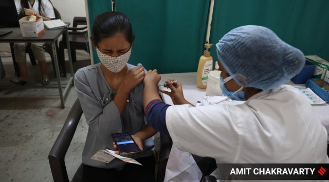 A beneficiary gets a shot of a Covid-19 vaccine in Nerul, Navi Mumbai. 