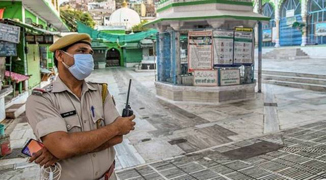 A cop stands guard at the empty Ajmer dargah (file/PTI)