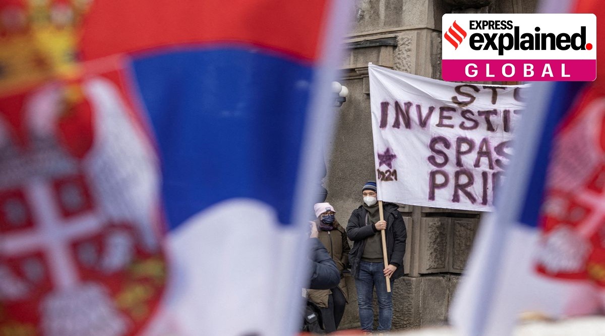 Demonstrators from environment groups hold banners as they block the streets in front of a government building during a protest against Rio Tinto's plans to open a lithium mine, in Belgrade, Serbia, December 18, 2021. (Reuters)
