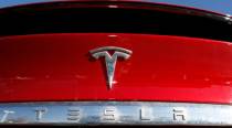 Tesla posts record profit, won’t produce new models in 2022