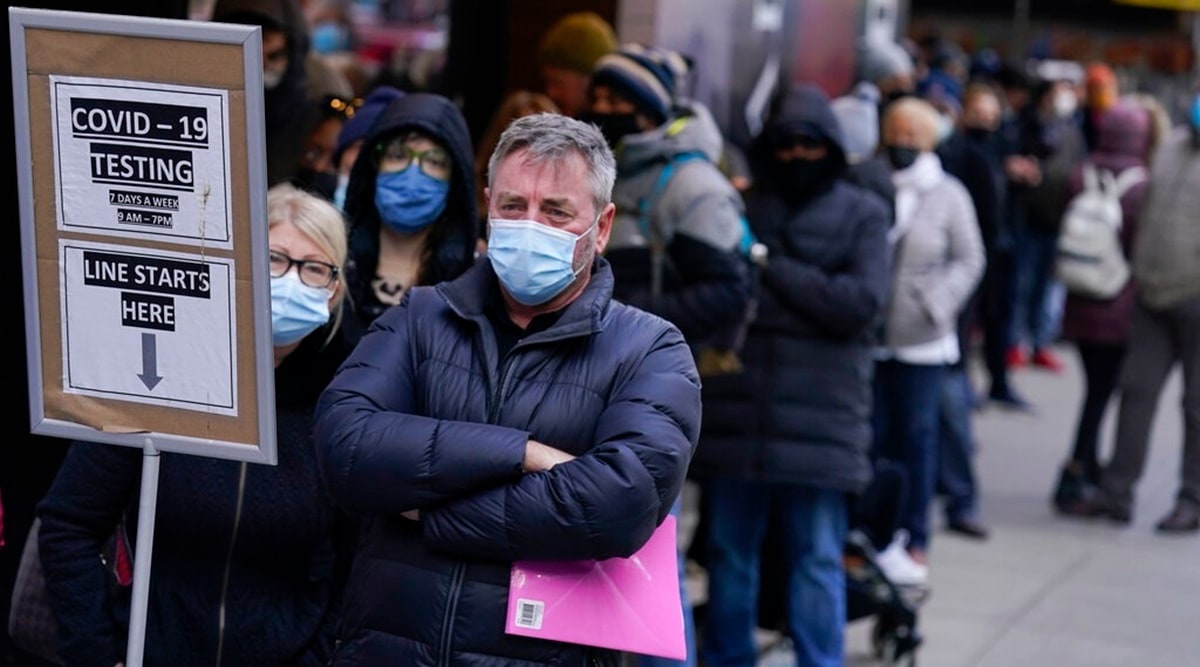People wait in line at a COVID-19 testing site in Times Square, New York. (AP)