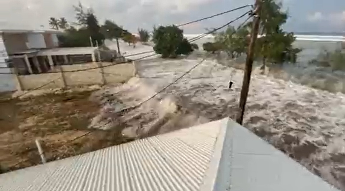 A screengrab from a video shared on social media shows waves crashing on to the coast. 
