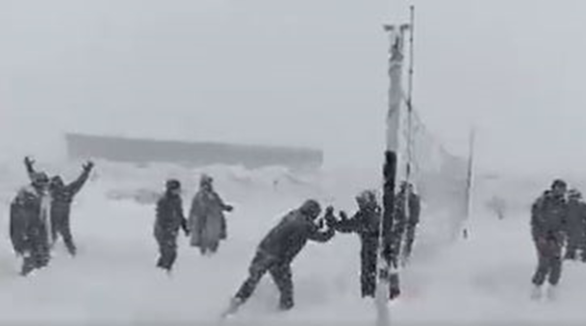soldiers, volleyball, soldiers playing volleyball, soldiers playing in snow covered area, Indian Army, indian express