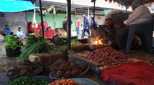 Vegetable vendor at popular Khanderao market in Vadodara. (Express photo by Bhupendra Rana)