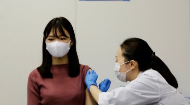 A staff of All Nippon Airways (ANA) receives a dose of the Moderna coronavirus disease (COVID-19) vaccine at the company's facility at Haneda airport in Tokyo, Japan June 14, 2021. (Reuters)