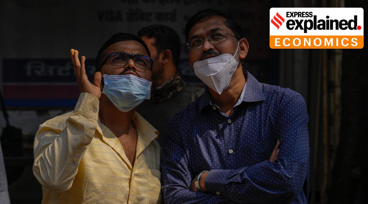 People watch the stock market index on a display screen on the facade of the Bombay Stock Exchange (BSE) building in Mumbai, Thursday, Feb. 24, 2022. (AP Photo/Rafiq Maqbool)


