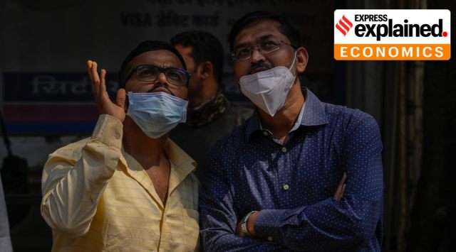 People watch the stock market index on a display screen on the facade of the Bombay Stock Exchange (BSE) building in Mumbai, Thursday, Feb. 24, 2022. (AP Photo/Rafiq Maqbool)



