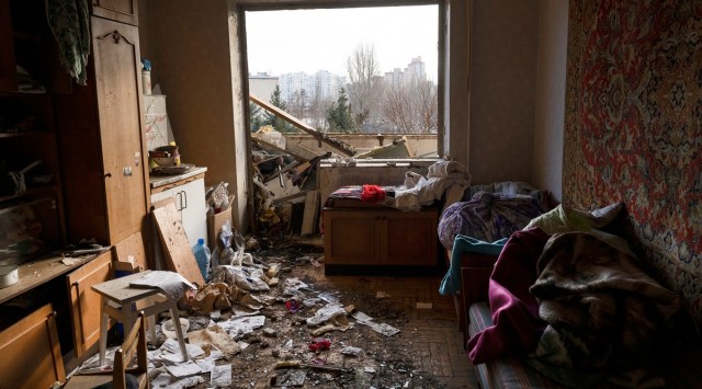 Damage from a missile in an apartment building in Kyiv, Ukraine, Feb. 25, 2022.  (Lynsey Addario/The New York Times)