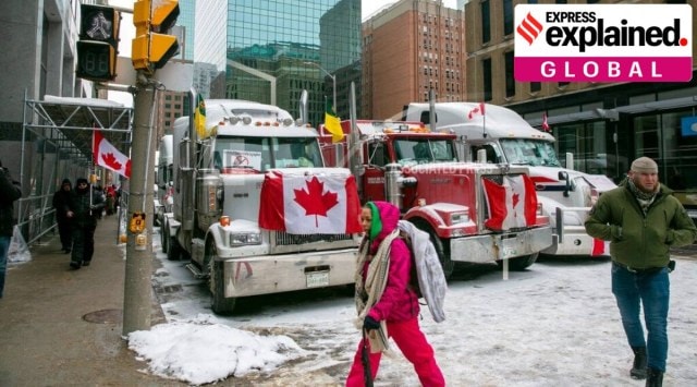 Drivers park their trucks blocking lanes of traffic to protest against COVID-19 restrictions in Ottawa, Ontario, on Feb. (Image source: AP)