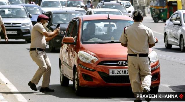 Delhi Civil Defence volunteers catch people without mask to fine Challan following Covid-19 guidelines, in New Delhi earlier this month.  (Express photo by Praveen Khanna)