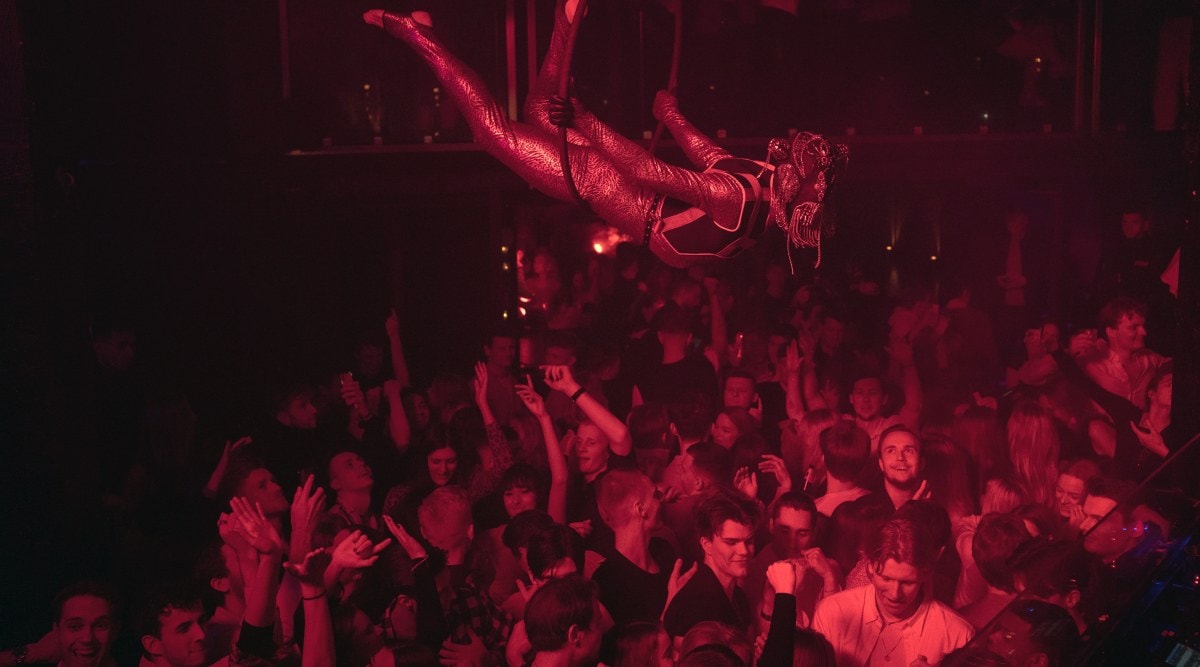 People gather at a nightclub in Copenhagen, Denmark, to celebrate as COVID-19 rules are relaxed on Saturday night Feb. 5, 2022. (Charlotte de la Fuente/The New York Times)
