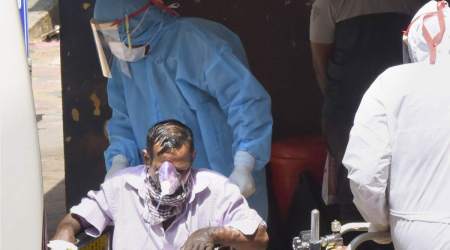 A Covid -19 patient on oxygen support being taken to Aluva Government Hospital, in Kochi, Saturday, Jan. 29, 2022. (PTI Photo)