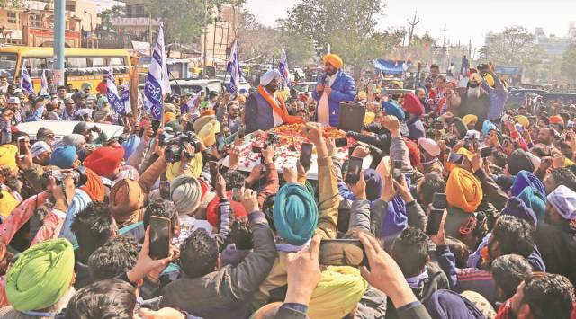 During a roadshow by AAP CM face Bhagwant Mann in favour of party candidate Kulwant Singh, in Mohali Sunday. (Express photo/ Jasbir Malhi)
