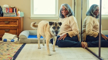 Darshna Shah and her dog Karl Malone, whose breakfasts include ashwagandha root and psyllium husk powder, at home in Cerritos, Calif., Feb. 3, 2022. (Ryan Young/The New York Times)