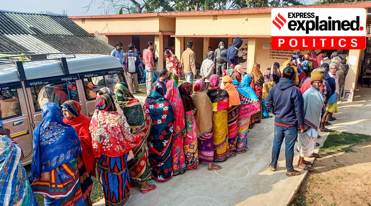 People stand in queues to cast their votes during the first phase of the Panchayat election, in Baleswar, Wednesday, Feb. 16, 2022. (PTI Photo)