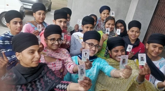 First-time voters pose after exercising their franchise in Punjab. (Express Photo)