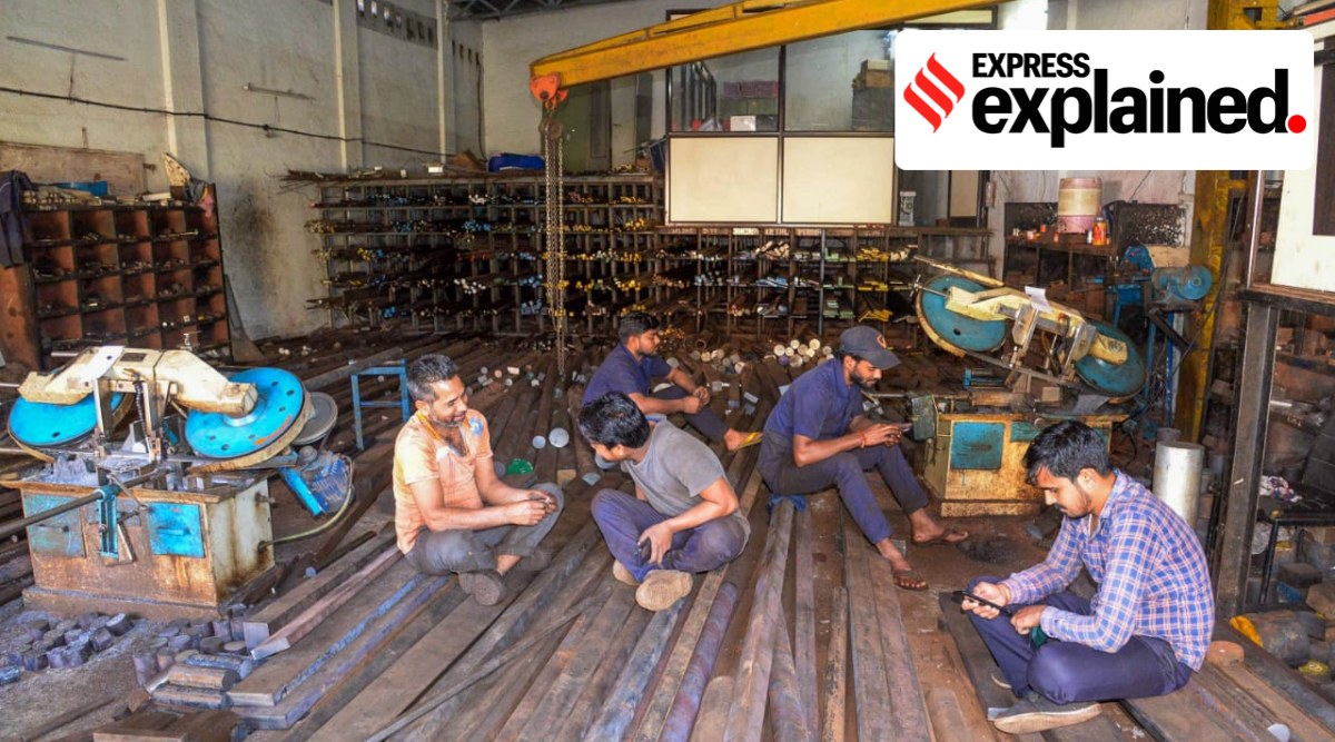 Employees at Bhosari MIDC wait for the power to be restored in Pune on Wednesday. (Express Photo: Rajesh Stephen)