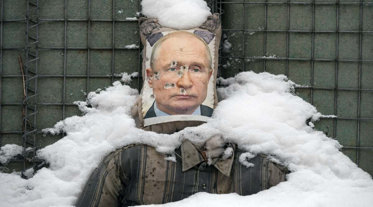 A bullet riddled effigy of Russian President Vladimir Putin, is coated by fresh snow at a frontline position in the Luhansk region, eastern Ukraine, Tuesday, Feb. 1, 2022. (AP Photo)