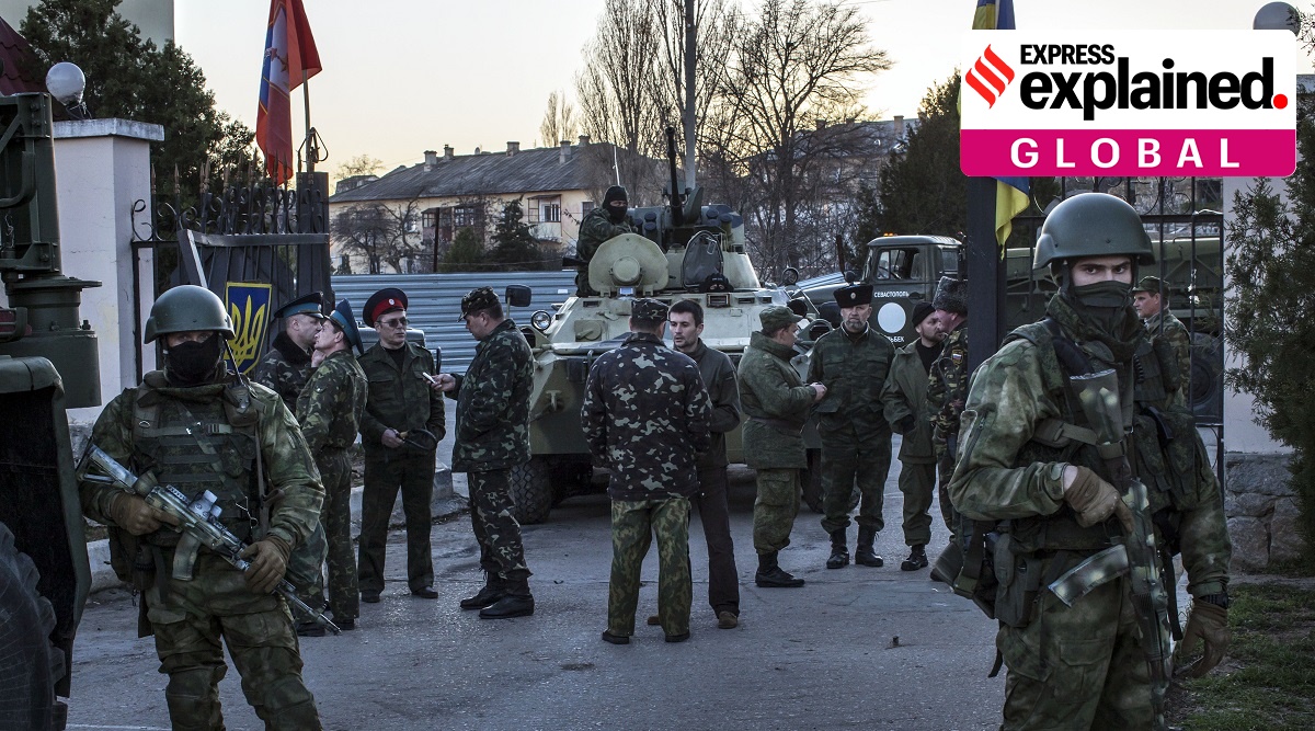 File photo of Russian forces standing at the entrance of a Ukrainian military base. (Photo: New York Times)