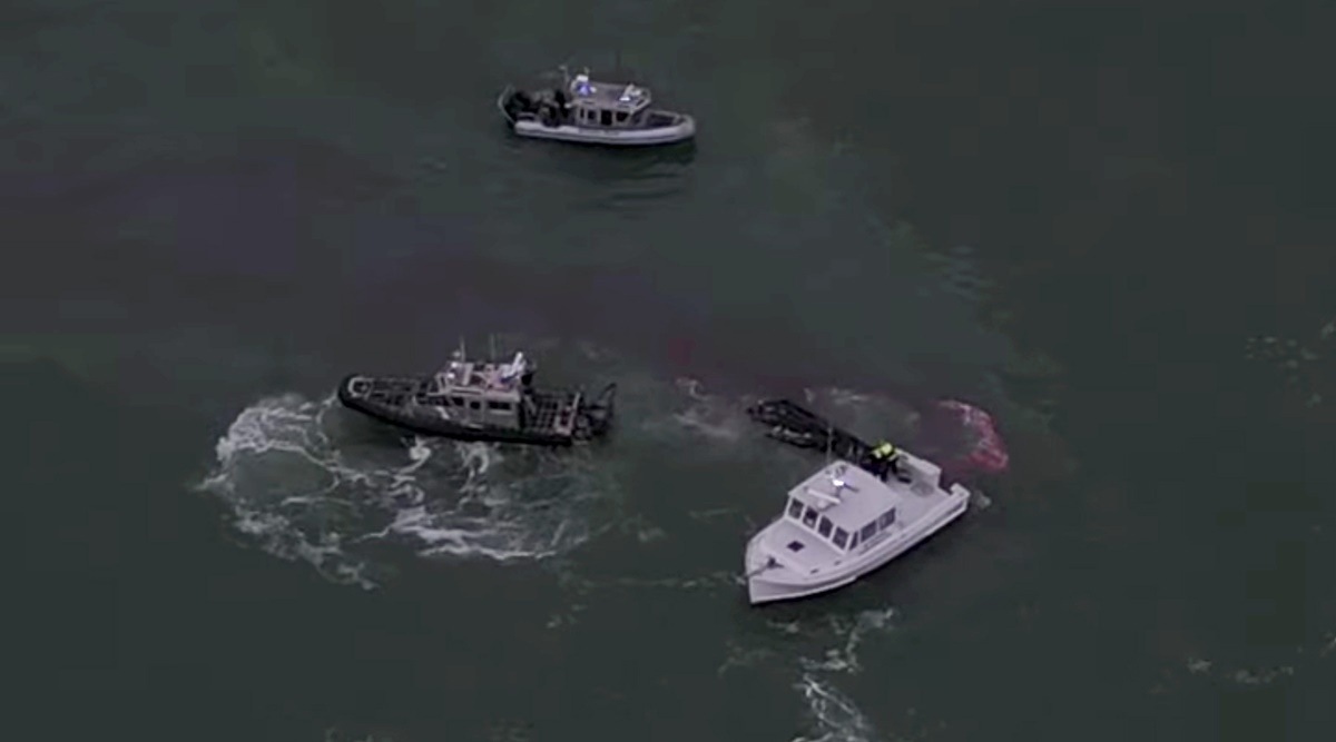 A photo provided by the Scituate Fire Department, of members of the Bing Bing fishing boat being rescued as seen in drone footage from the Scituate Fire Department. (New York Times)