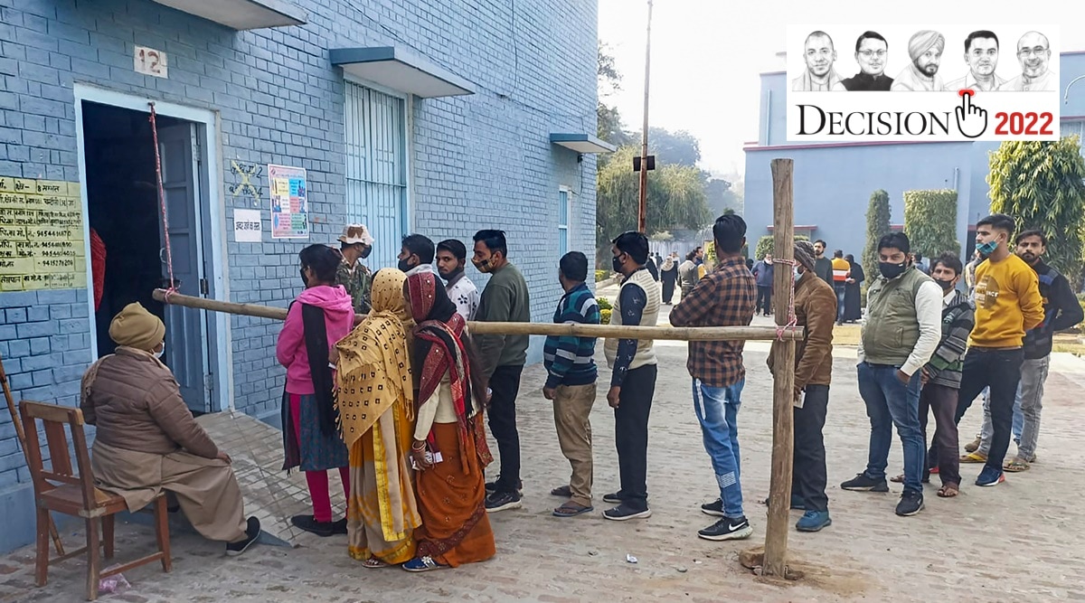 People queue up to cast their votes, in Sambhal on Monday. (PTI Photo)