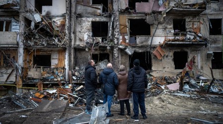 People look at the damage following a rocket attack the city of Kyiv, Ukraine. (AP)
