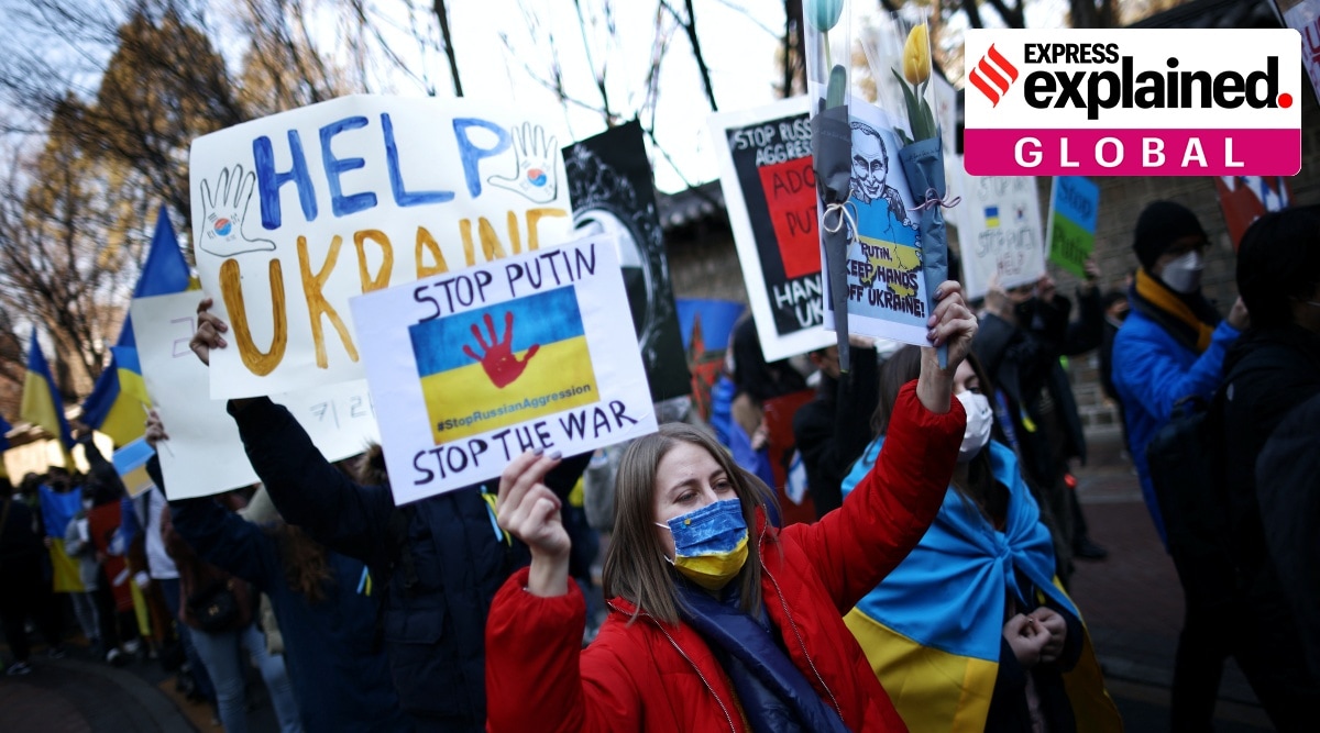 Ukrainian people march toward the Russian embassy during a protest against the massive military operation by Russia against Ukraine, in Seoul, South Korea, February 27, 2022.  (Reuters)
