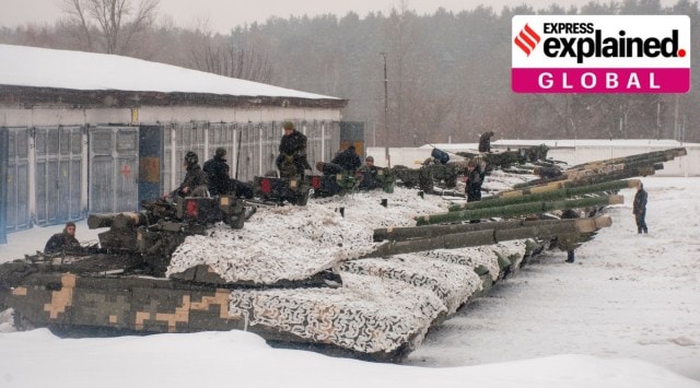 Ukrainian soldiers examine their tanks at a military unit close to Kharkiv, Ukraine, Monday, Jan. 31, 2022. (AP Photo/Andrew Marienko)


