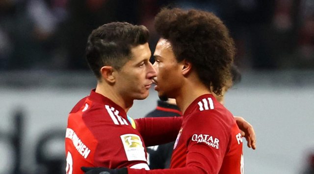 Bayern Munich's Leroy Sane and Robert Lewandowski embrace after the match (Source: Reuters)