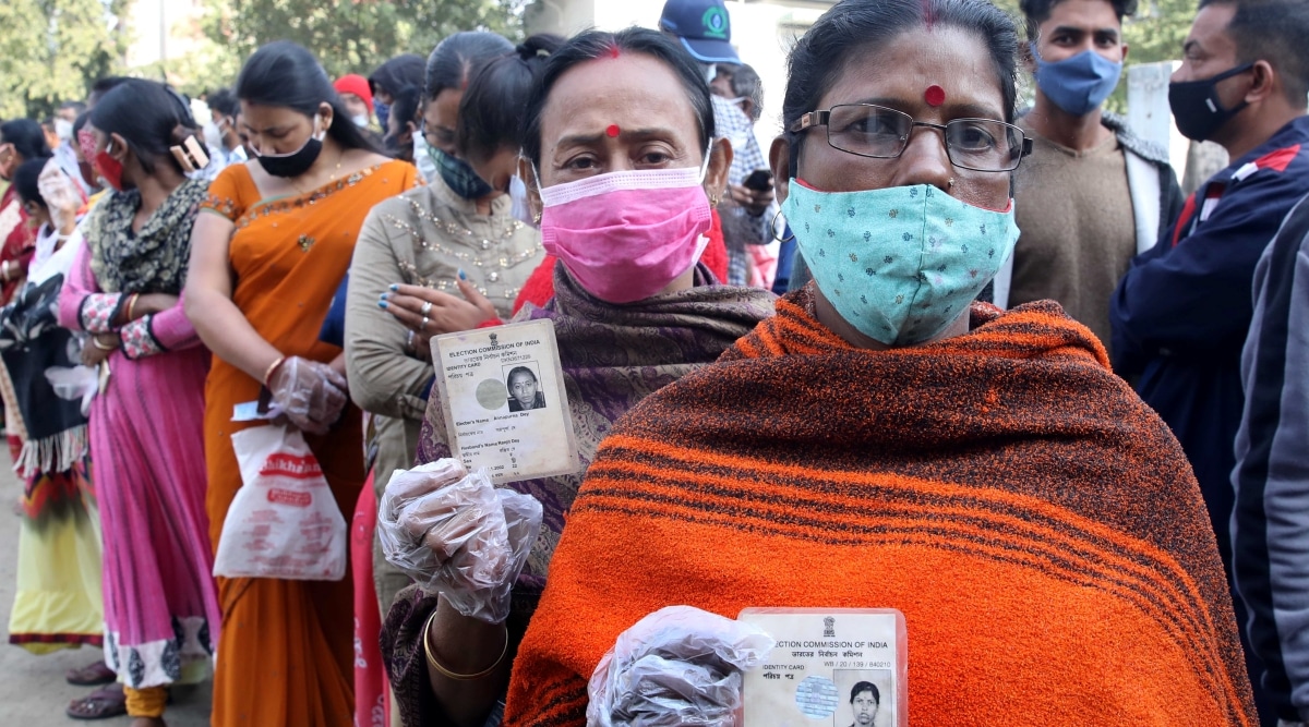Voters at Bidyadhari Bidyalaya booth in Duttabad , Salt Lake , Kolkata during the Bidhannagar municipal election on Saturday, February 12, 2022. (Express photo by Paul)