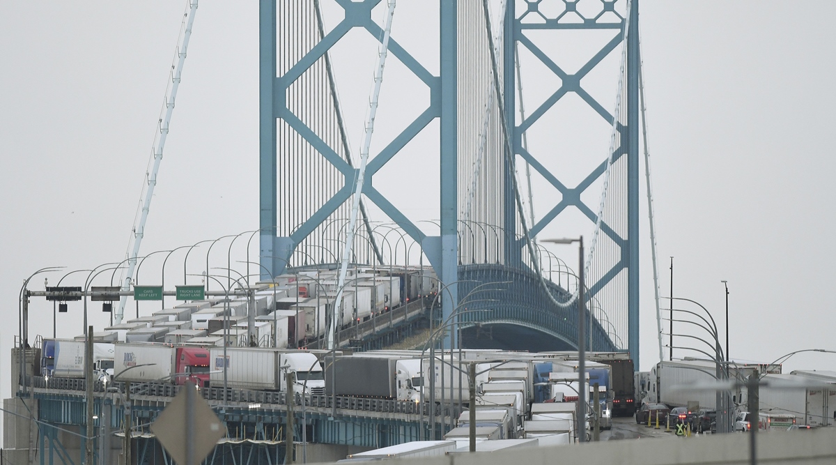 Trucks are backed up heading to and from Canada on the Ambassador Bridge, due to protests on the Windsor side, in Detroit February 7, 2022.  (AP)