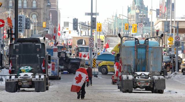 Truckers end US border blockade, siege in Ottawa goes on