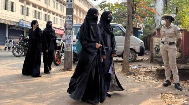 Students in hijab outside a school in Udupi. (Reuters/File)