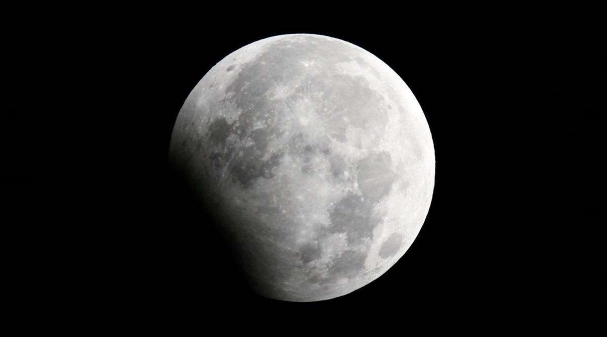 The moon is seen during a partial lunar eclipse in Shanghai January 1, 2010. (REUTERS)
