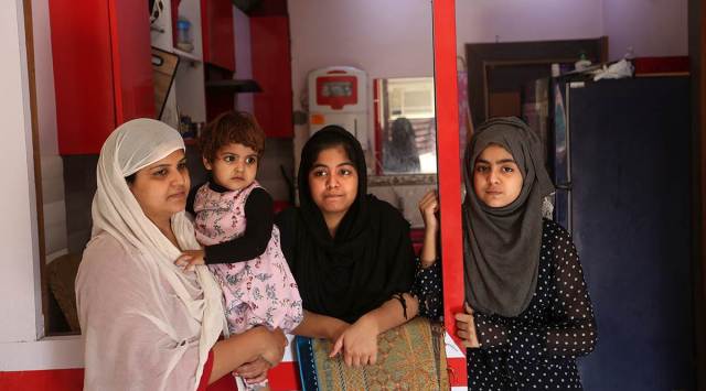 14-year-old Fiza (right) with her family. She lost her father, Md Muddassar, in the violence. ( Gajendra Yadav)