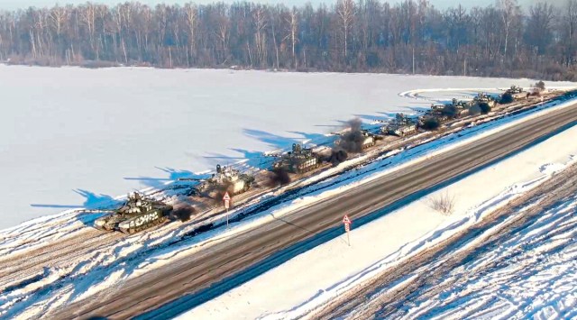 In this photo taken from video provided by the Russian Defense Ministry Press Service February 15, 2022, Russian army tanks move back to their permanent base after drills in Russia. (AP)